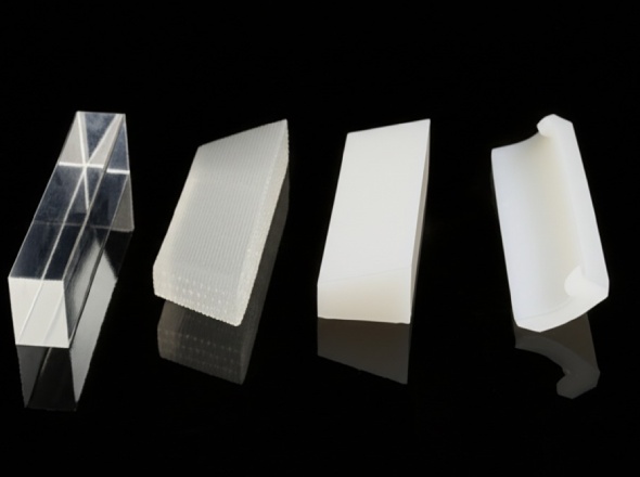 CNC machined plastic parts displaying mirror, matte, textured, and medical-grade surface finishes