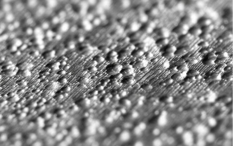 Superfície metálica moída microscópica